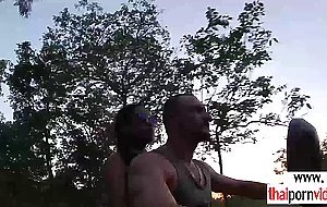 Sexy amateur Thai teen Cherry fucked by a big white cock on a bike outdoor