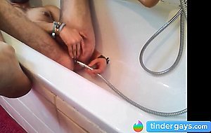 Bi-guy using shower head, squirting water, enema