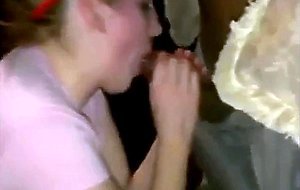 Blonde slut sucks off two black dicks