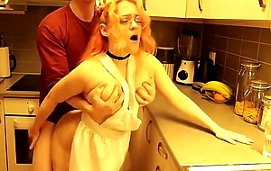 Amateur kitchen fucking with a big titty redhead