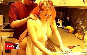 Amateur kitchen fucking with a big titty redhead
