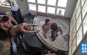 3 wet and soapy whores each gets a turn to get fucked in STANDING DOGGYSTYLE by 1 cock , mixed race