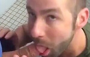 Handsome guy sucks dick in restroom stall