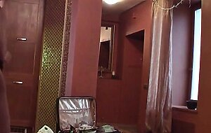 Blonde beauty has fun stripping her clothes off