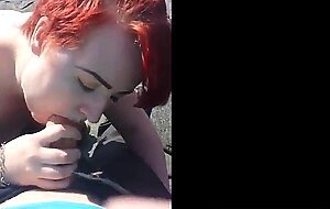 Red hair painted girl sucks dick outdoors and swallows