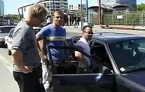 Outdoor gangbang in busy neighborhood