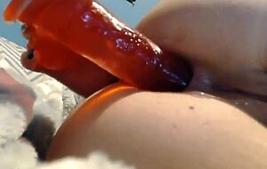 girl takes a big toy up the butt...