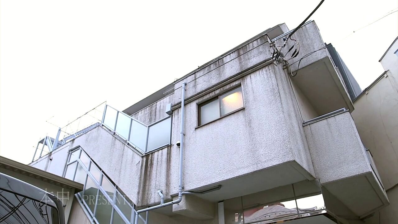 A woman on a train looking disturbed by a perverted encounter