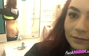 Big-Ass Schoolgirl's Strip Tease and Pussy Play in a Public Bathroom
