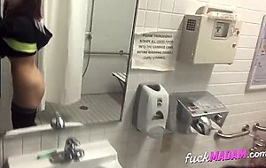Big-Ass Schoolgirl's Strip Tease and Pussy Play in a Public Bathroom