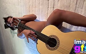 Hot Paul showing her medium tits and pussy with guitar