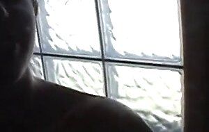 Hot slut masturbates in the shower