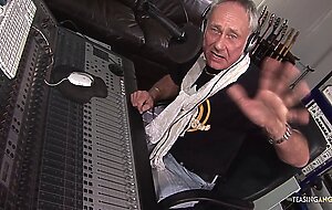 Busty brunette chick gets fucked by two music producers
