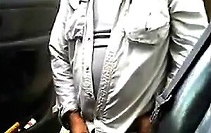 Bearded daddy strokes his cock by his truck outdoors.