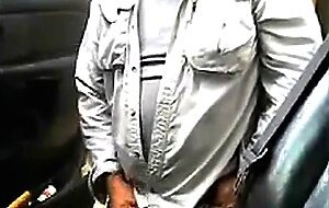 Bearded daddy strokes his cock by his truck outdoors.