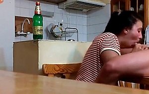 Cock sucking on the kitchen table