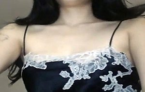 Sexy brunette webcam model flashes her tits
