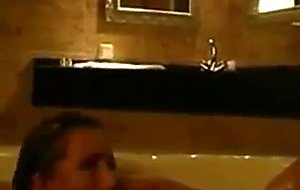 Couple having fun in the honey tub