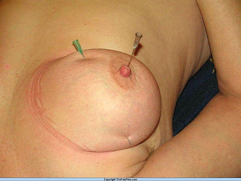 Natural blonde has her breasts and nipples pierced with needles