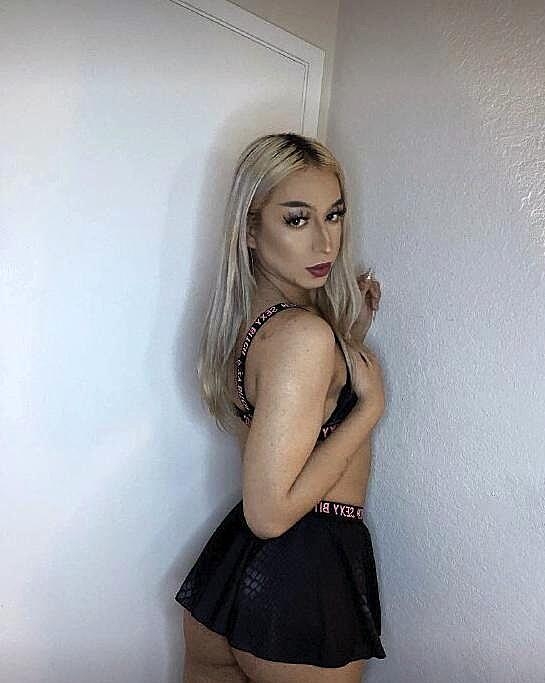 Pretty blonde shemale Karina Paradise shows her curvy ass and her big balls