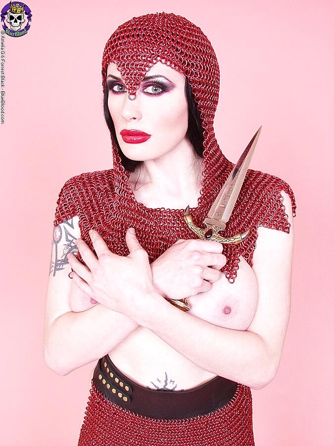 Busty Chick Morrigan Hel Licks A Dagger While Wearing Chain Mail And Otk Boots Big-Tits, Cosplay, Fetish, Mature, Milf