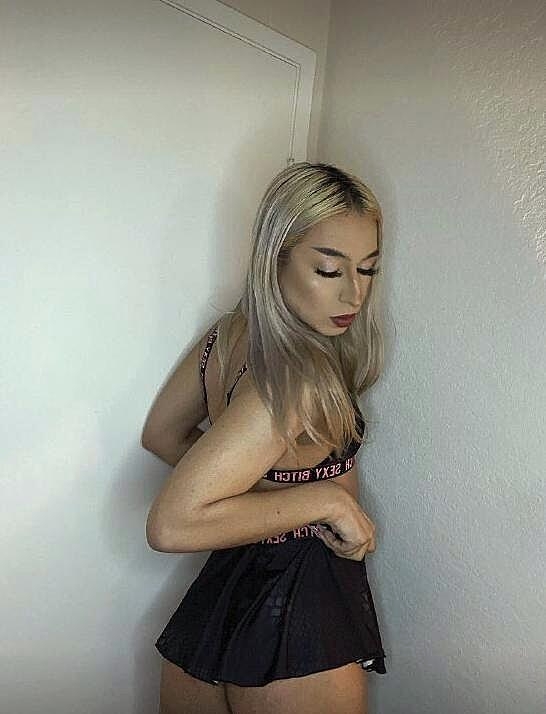 Pretty blonde shemale Karina Paradise shows her curvy ass and her big balls